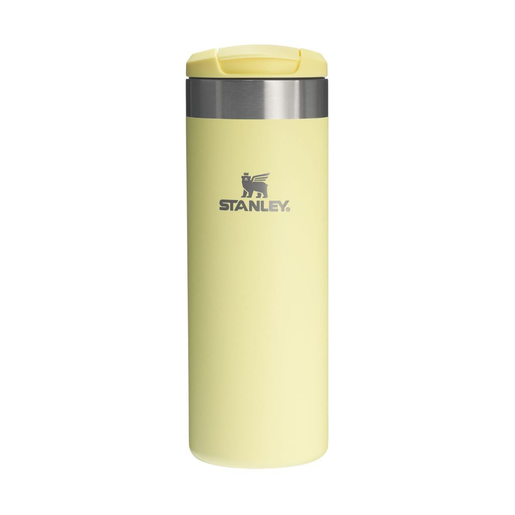 Yellow Stanley insulated mug on a white background
