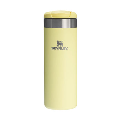 Yellow Stanley insulated mug on a white background