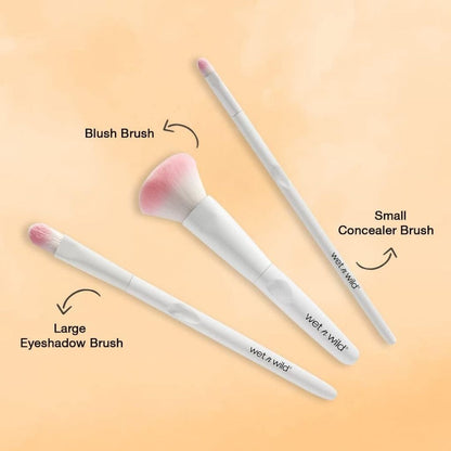 Three makeup brushes labeled 'Large Eyeshadow Brush', 'Blush Brush', and 'Small Concealer Brush' on a gradient background.