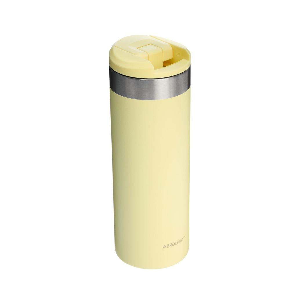 Yellow insulated mug with silver lid on a white background