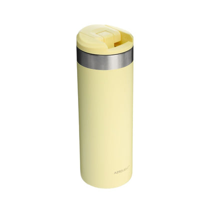 Yellow insulated mug with silver lid on a white background