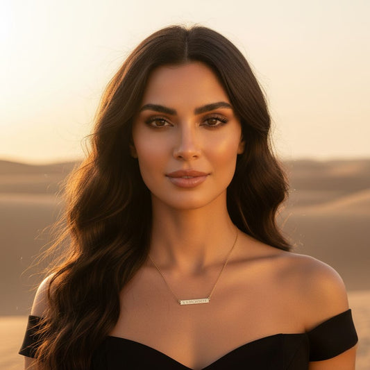 Woman with long dark hair and a black off-shoulder top against a sunset background