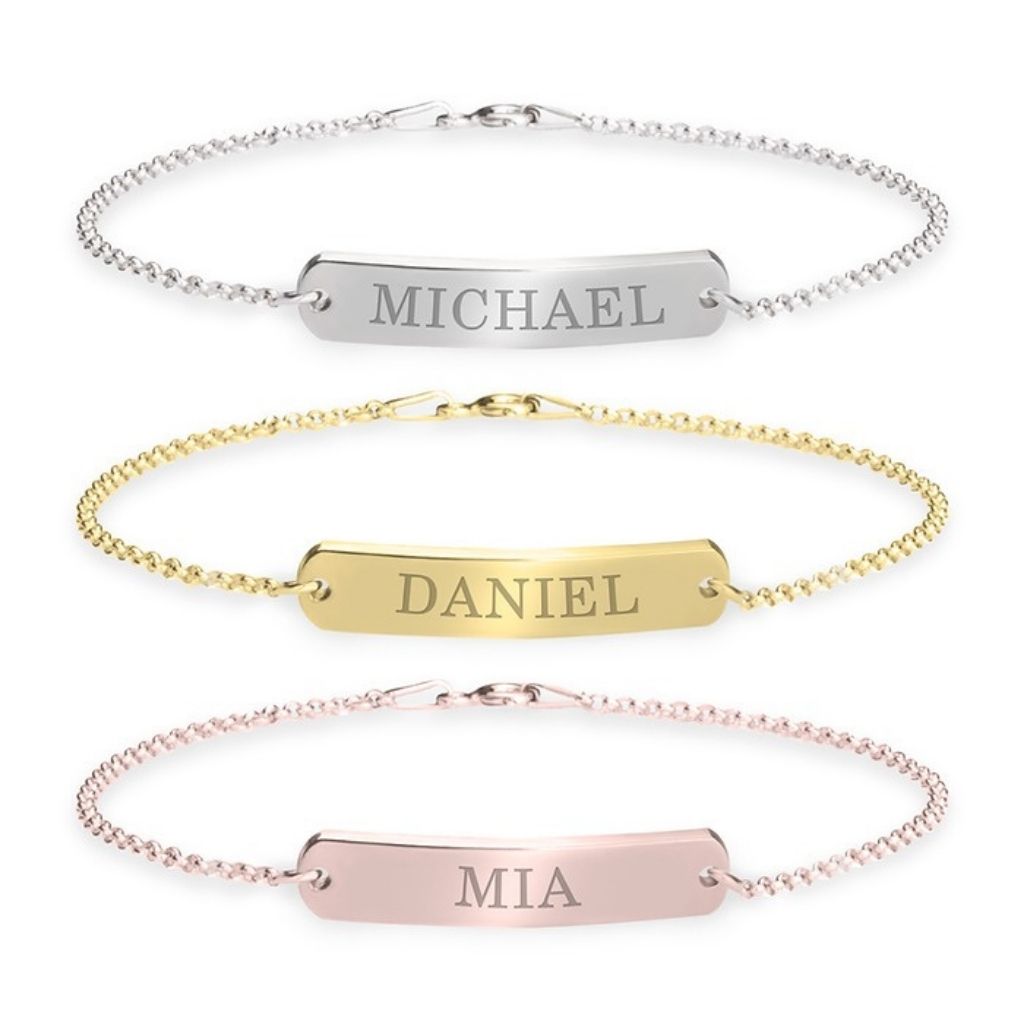 Three name bracelets in silver, gold, and rose gold on a white background.