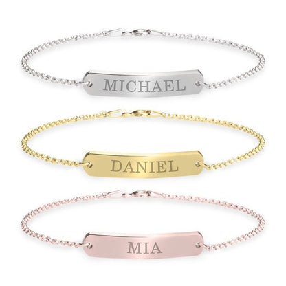 Three name bracelets in silver, gold, and rose gold on a white background.