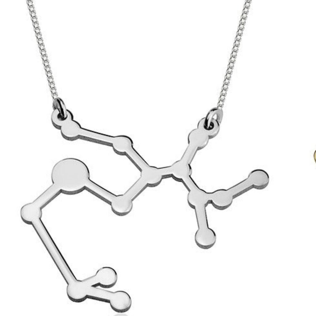 Silver molecular structure pendant on a chain against a white background