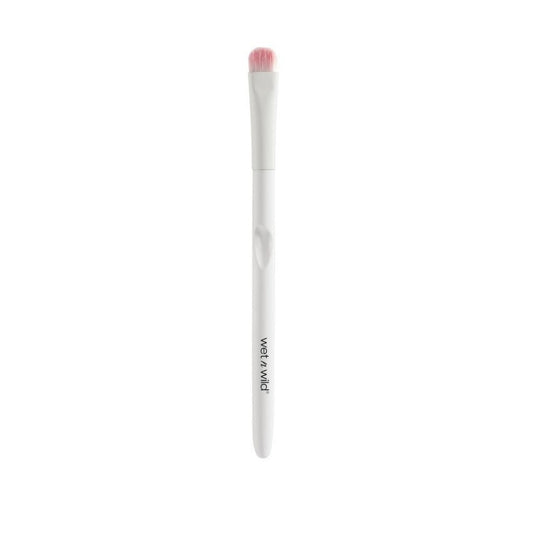 Makeup brush with pink bristle tip on a white background