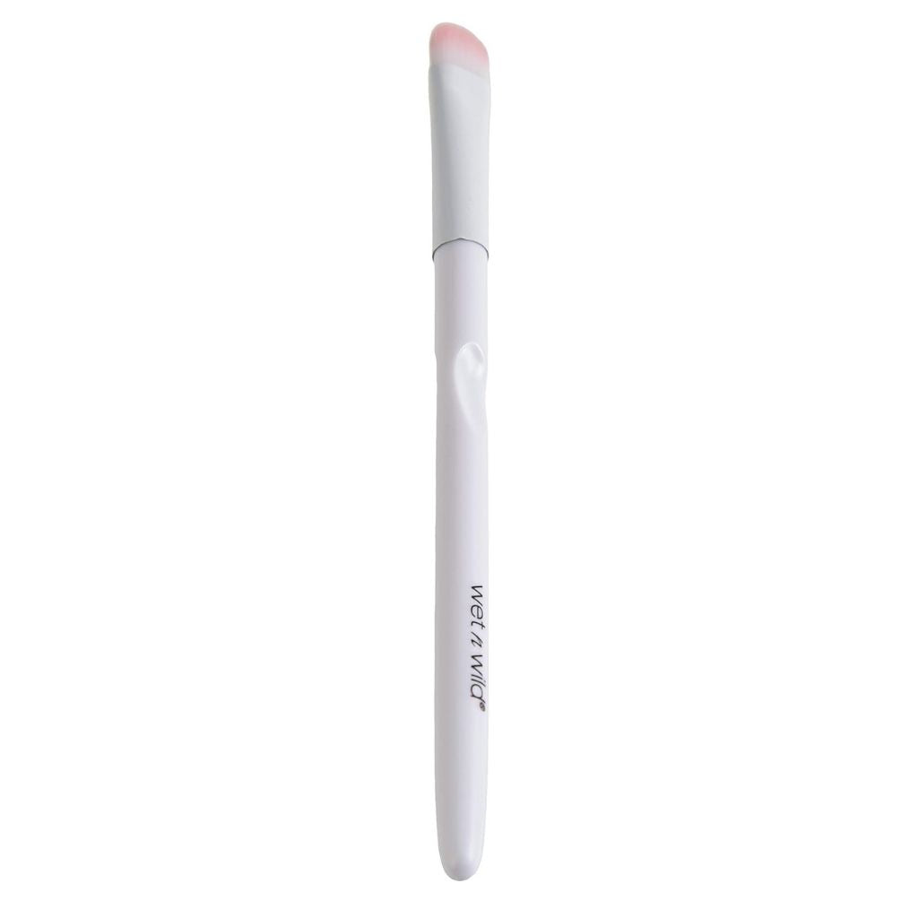White makeup brush with pink bristle tip on a white background
