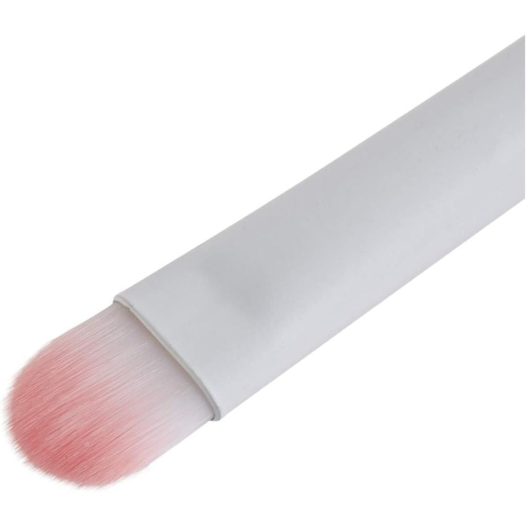 Makeup brush with pink bristle head on a white background