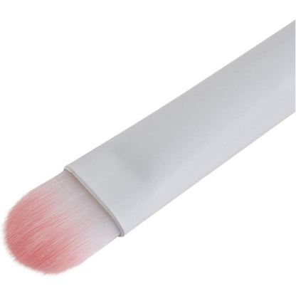 Makeup brush with pink bristle head on a white background