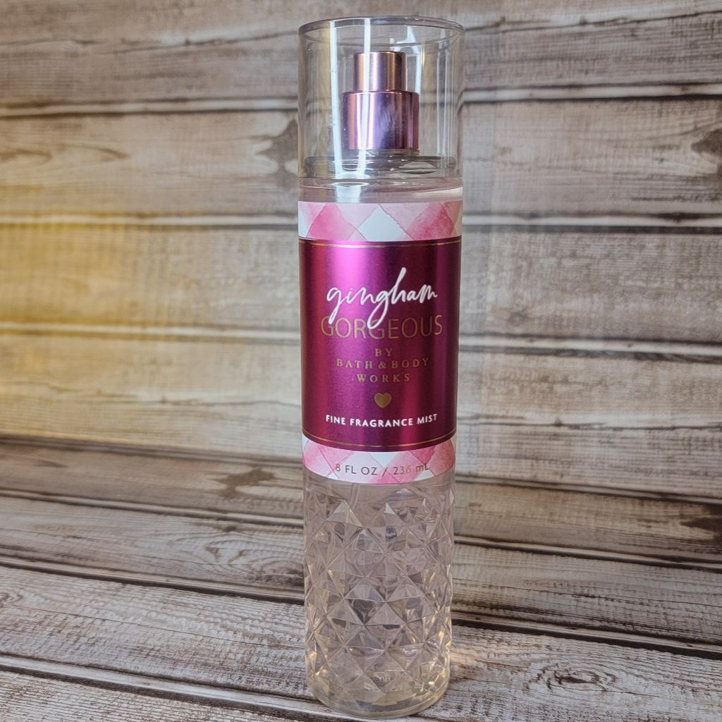 Bath and Body Works fragrance mist bottle on a wooden surface