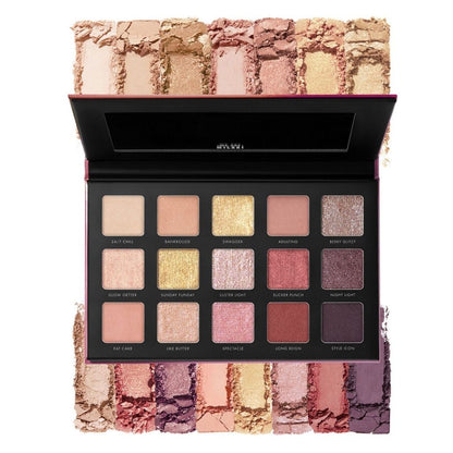 Makeup palette with various shades of eyeshadow on a white background