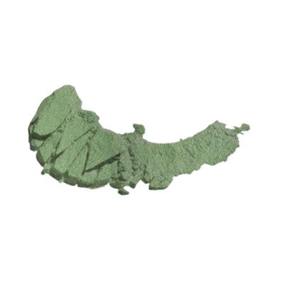 Green powder on a white background