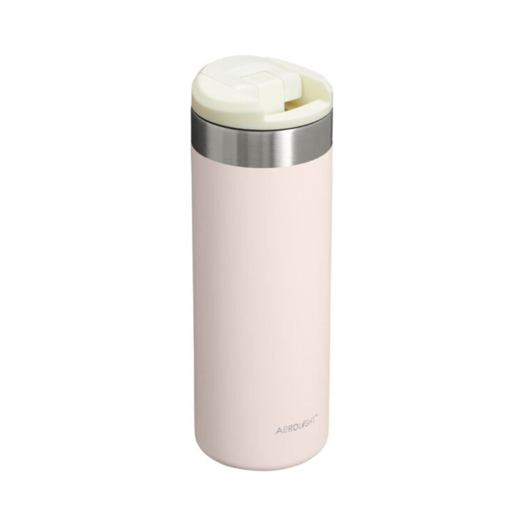 Pink thermos bottle with silver lid on a white background
