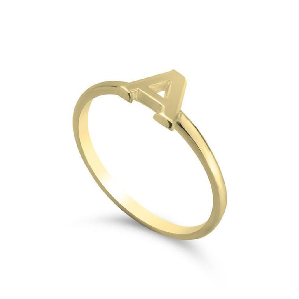 Gold ring with a letter 'A' on a white background