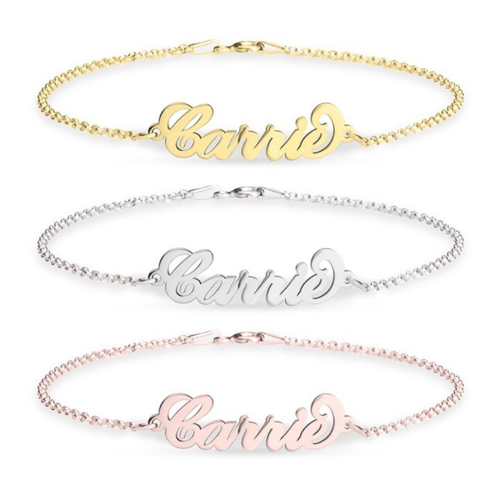 Three name bracelets in gold, silver, and rose gold on a white background