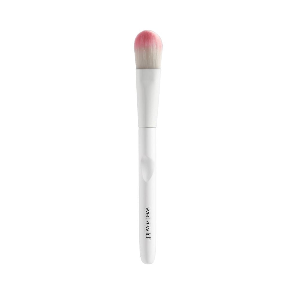 Makeup brush with pink bristle tip on a white background