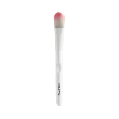 Makeup brush with pink bristle tip on a white background