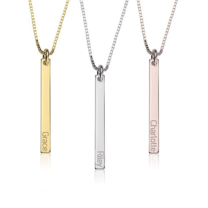 Three vertical bar necklaces in gold, silver, and rose gold on a white background.
