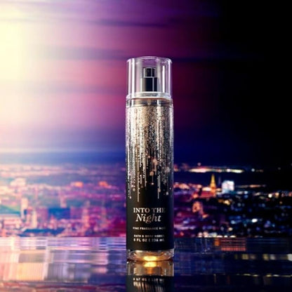 Perfume bottle labeled 'Into the Night' with a cityscape background
