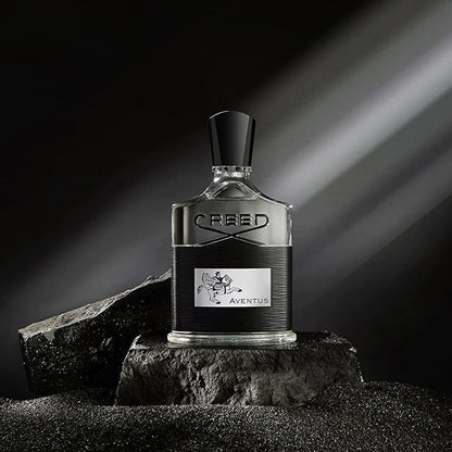 Creed Aventus perfume bottle on a dark background