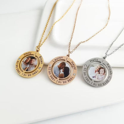Three necklaces with circular pendants featuring photos and text on a white surface