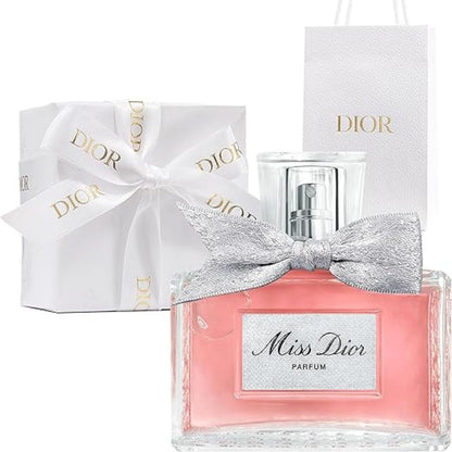 Miss Dior perfume bottle with a silver bow and Dior packaging on a white background