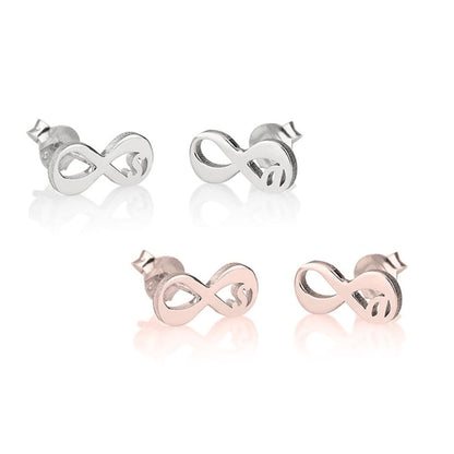 Set of four infinity symbol earrings in silver and rose gold on a white background