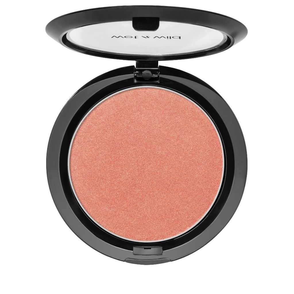 Compact blush in a black case on a white background