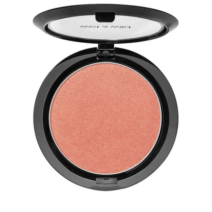 Compact blush in a black case on a white background
