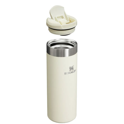 Stanley insulated tumbler with beige lid on a white background