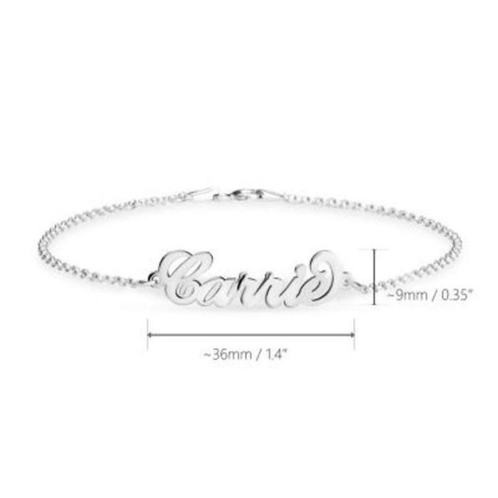 Silver bracelet with 'Carrie' engraving on a white background