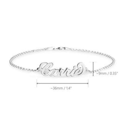Silver bracelet with 'Carrie' engraving on a white background