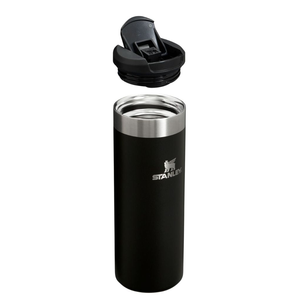 Black Stanley tumbler with a silver interior on a white background