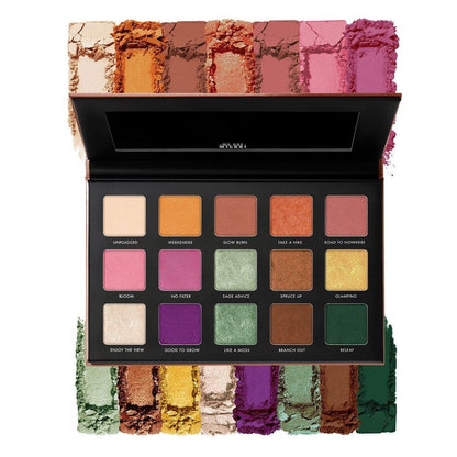 Makeup palette with various colors and brand name on a white background