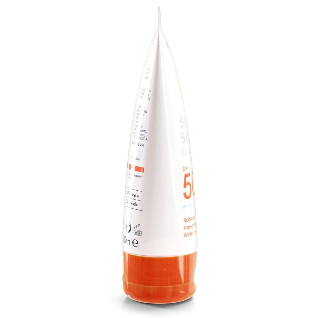 White and orange bottle with measurement markings on a white background
