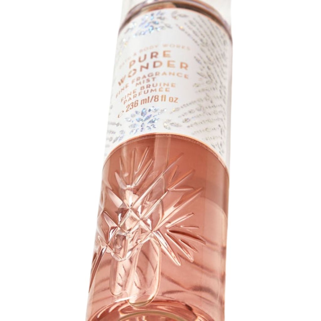 Bottle of 'Pure Wonder' fragrance with floral design on a white background
