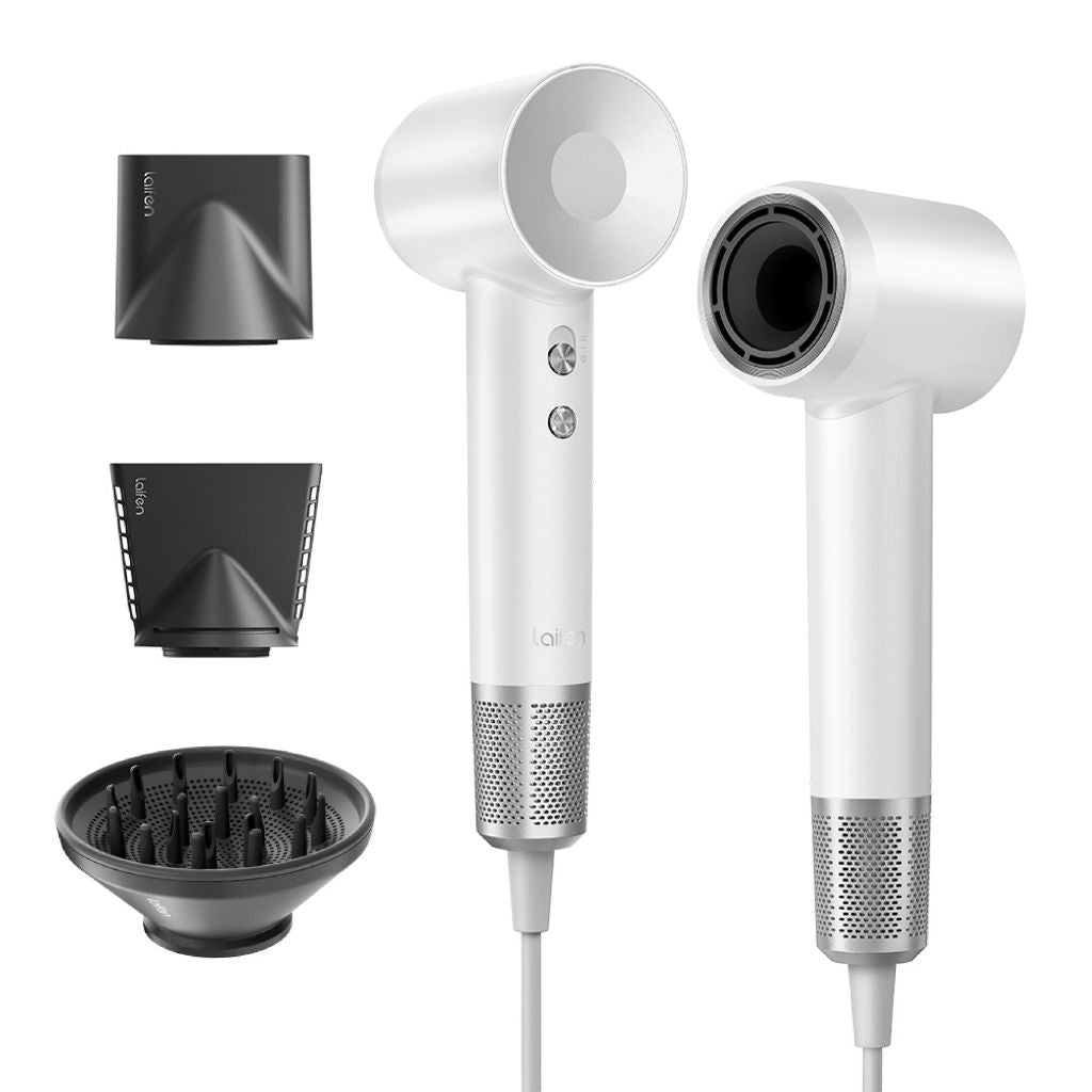 White hair dryer with attachments on a white background