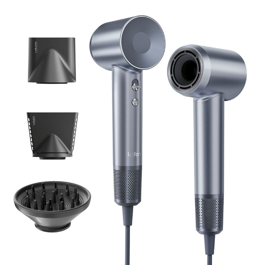 Silver hair dryer with multiple attachments on a white background