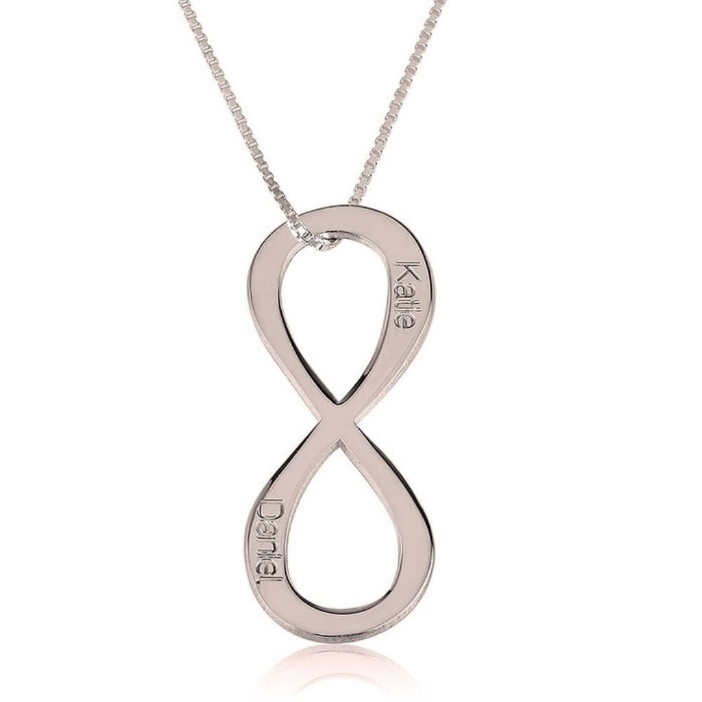 Silver infinity pendant necklace on a white background