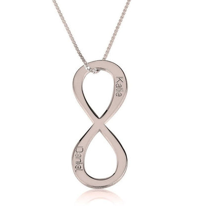 Silver infinity pendant necklace on a white background