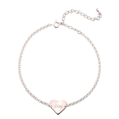 Silver bracelet with a heart-shaped nameplate on a white background