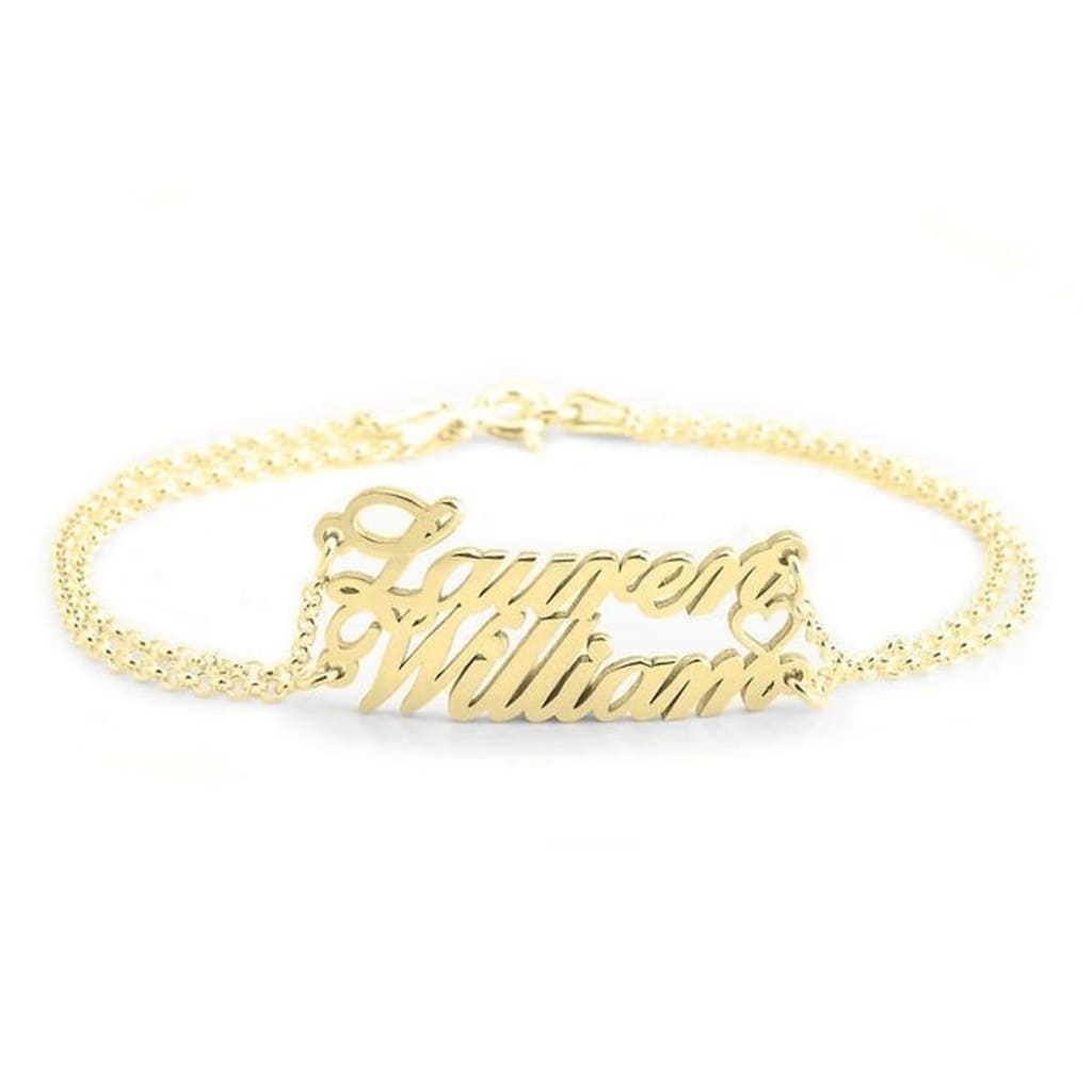 Gold bracelet with 'Supreme Williams' engraving on a white background