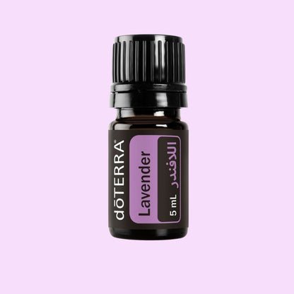 doTERRA Lavender essential oil bottle on a light purple background