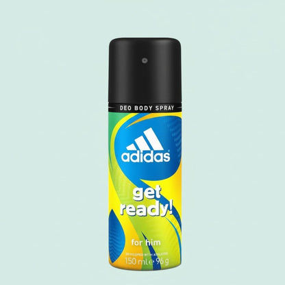 Adidas deodorant spray bottle on a light blue background