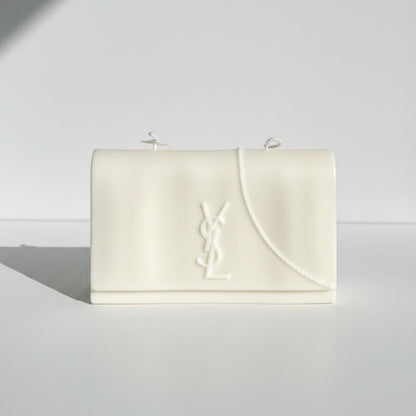 White clutch bag with a brand logo on a light gray background