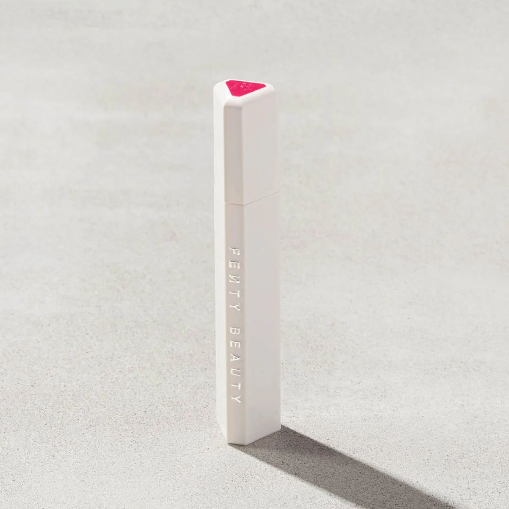 Fenty Beauty product on a textured gray background