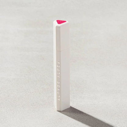 Fenty Beauty product on a textured gray background