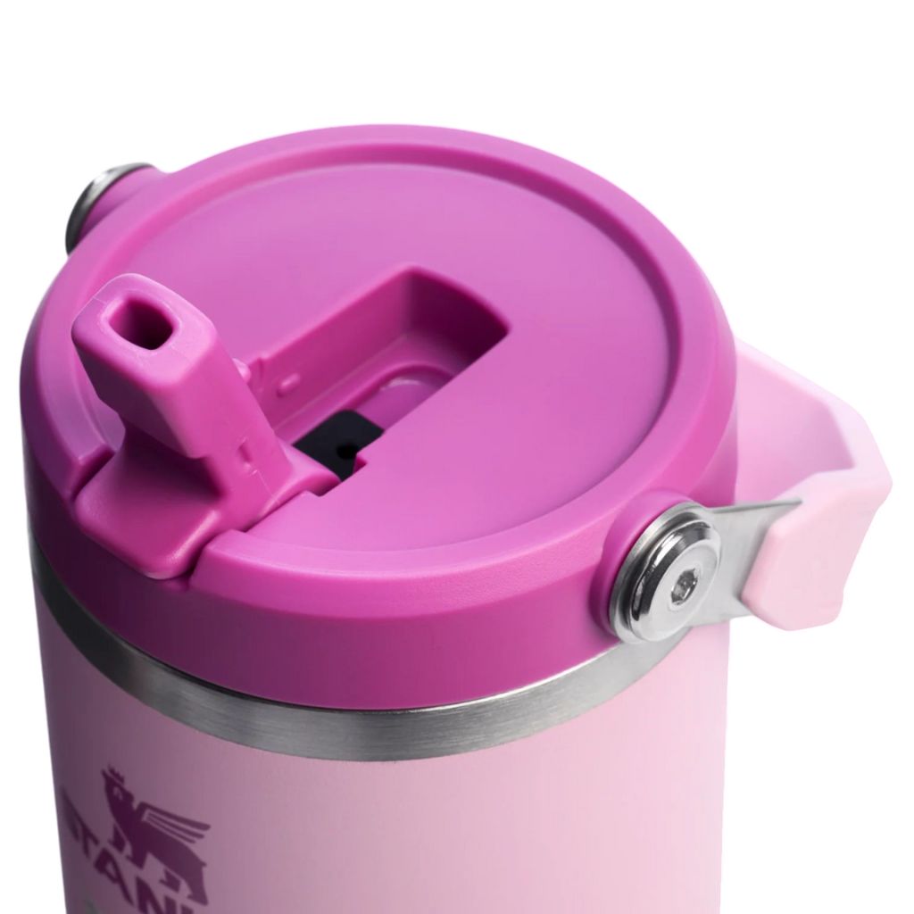 Pink insulated mug with a lid on a white background