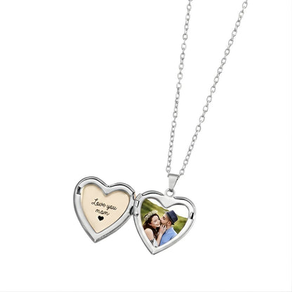 Heart-shaped locket with 'I love you mom' message and photo on a white background