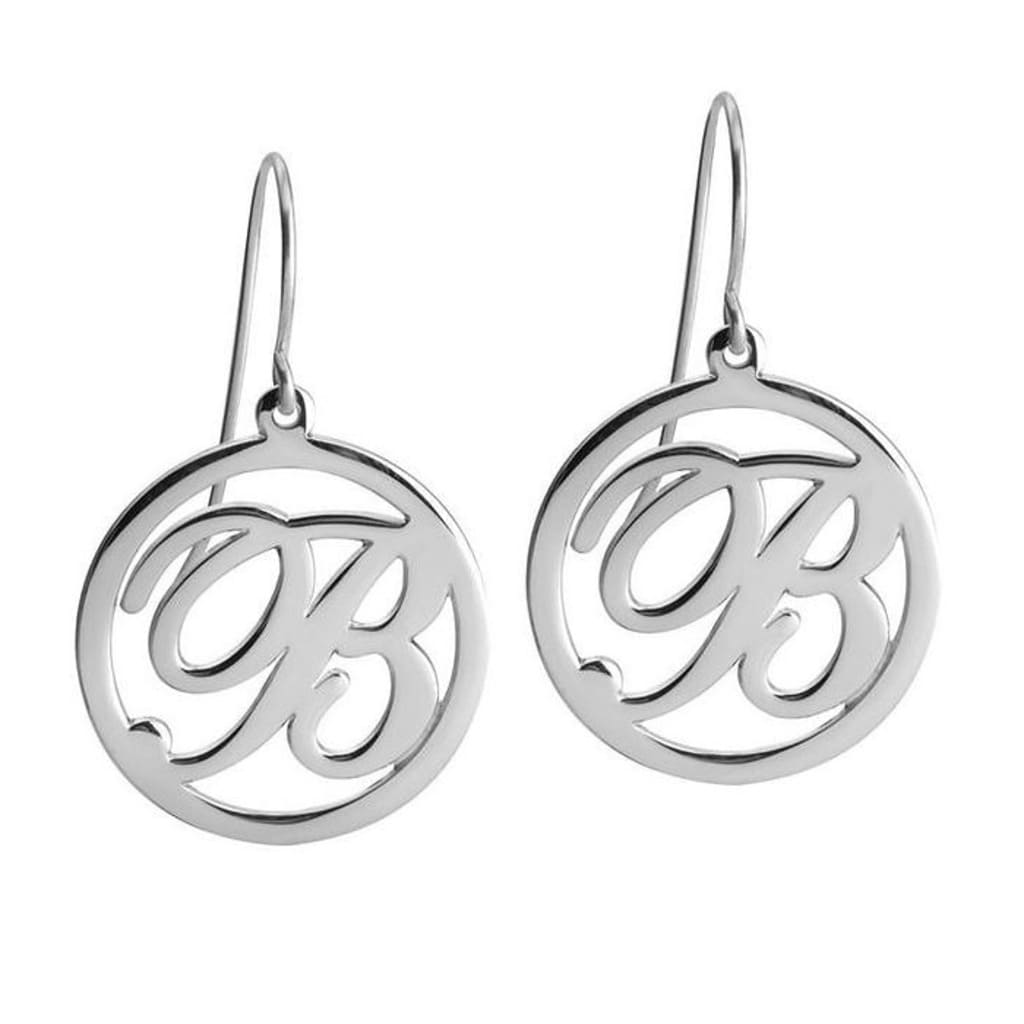 Silver earrings with circular design on a white background